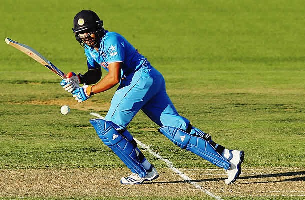 Rohit Sharma of India plays the ball away